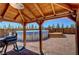 This covered barbecue area is perfect for grilling and outdoor dining near the above ground pool at 1361 Moose St, Pahrump, NV 89048