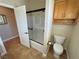 Bathroom featuring glass enclosed shower, storage cabinet, and tile flooring at 1361 Moose St, Pahrump, NV 89048