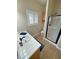 Bathroom featuring vanity with sink, shower, and window for natural lighting at 1361 Moose St, Pahrump, NV 89048
