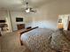 Spacious bedroom featuring vaulted ceilings, neutral carpet, and convenient ensuite access at 1361 Moose St, Pahrump, NV 89048