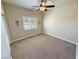 Bedroom featuring carpet, white-painted trim and a window with wooden shutters at 1361 Moose St, Pahrump, NV 89048