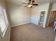 Spacious bedroom with carpet and window with shutters, plus ensuite bathroom at 1361 Moose St, Pahrump, NV 89048