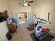 Large home gym boasts ample space, views of the home, and natural light at 1361 Moose St, Pahrump, NV 89048