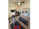 Home gym features ample space, exercise equipment, a ceiling fan, and easy access to other areas at 1361 Moose St, Pahrump, NV 89048
