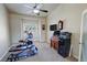 Home gym with exercise equipment, storage, a window, and ample natural light at 1361 Moose St, Pahrump, NV 89048