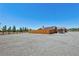 View of the home's solar panels and fenced backyard, with a gravel surround at 1361 Moose St, Pahrump, NV 89048