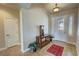 Foyer featuring tile flooring, a glass-paneled front door, and traditional decor at 1361 Moose St, Pahrump, NV 89048