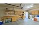 Garage interior with large water tank, freezer, and workbench with storage at 1361 Moose St, Pahrump, NV 89048