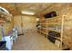 Storage shed interior with plywood walls, shelving, and ample storage space at 1361 Moose St, Pahrump, NV 89048