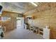 Functional storage building features plywood walls, shelving, and a work area at 1361 Moose St, Pahrump, NV 89048