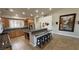 Bright kitchen with a large island, wood cabinets, granite counters and stainless steel appliances at 1361 Moose St, Pahrump, NV 89048