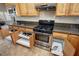 Kitchen boasts stainless steel appliances, granite counters, and slide-out drawers for convenience at 1361 Moose St, Pahrump, NV 89048
