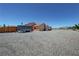 A view of the large lot, featuring a large driveway and plenty of room for parking at 1361 Moose St, Pahrump, NV 89048