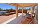 Relax on the covered patio with views of the above ground pool and wood fence at 1361 Moose St, Pahrump, NV 89048