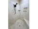 Modern shower featuring sleek marble-patterned walls and a rainfall shower head at 1361 Moose St, Pahrump, NV 89048