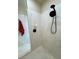 Updated walk-in shower with marble-style walls, black fixtures, and a built-in shelf at 1361 Moose St, Pahrump, NV 89048