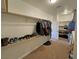 Functional walk-in closet with built-in shelving and hanging rods at 1361 Moose St, Pahrump, NV 89048