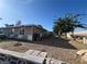Wide shot of the home's backyard and side yard with exterior storage at 1429 S Sandhill Rd, Las Vegas, NV 89104