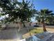 Landscaped backyard featuring mature trees and a gravel ground cover at 1429 S Sandhill Rd, Las Vegas, NV 89104
