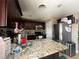 The kitchen boasts granite counters, stainless appliances, and ample cabinet space at 1429 S Sandhill Rd, Las Vegas, NV 89104