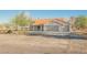 Charming single-story home with a terracotta tile roof and a spacious three-car garage at 1601 Iguana St, Pahrump, NV 89048