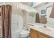 Standard bathroom with shower-tub combo, single sink vanity, and white tile at 169 Alterra Dr, Henderson, NV 89074