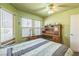 Bedroom featuring a bed, built-in desk, and ample natural light from the windows at 169 Alterra Dr, Henderson, NV 89074