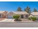 Charming single-story home with a two-car garage, desert landscaping and a tile roof at 169 Alterra Dr, Henderson, NV 89074