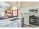 Kitchen area with marble countertops, stainless steel appliances, and an open floor plan at 169 Alterra Dr, Henderson, NV 89074