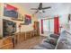 Cozy living room showcasing media center and natural light from large window at 169 Alterra Dr, Henderson, NV 89074