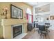 Cozy living room area with fireplace, wood flooring, and an open floor plan at 169 Alterra Dr, Henderson, NV 89074