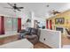 A living room features a ceiling fan and a fireplace at 169 Alterra Dr, Henderson, NV 89074