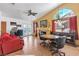 Vaulted living room featuring a fireplace, fan, and view to exterior at 169 Alterra Dr, Henderson, NV 89074