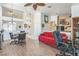 Bright living room with tile floors, a modern ceiling fan, and open access to the kitchen at 169 Alterra Dr, Henderson, NV 89074