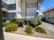 Exterior shot of a multi-Gathering home with a small garden out front and well-maintained landscaping at 1748 Jupiter Ct # C, Las Vegas, NV 89119