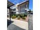 Two-story condo exterior featuring well-maintained landscaping, covered parking, and a welcoming facade at 1748 Jupiter Ct # C, Las Vegas, NV 89119