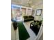 Bright sun room with tile flooring, ceiling fan, and comfortable seating area with accent pillows at 1748 Jupiter Ct # C, Las Vegas, NV 89119