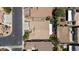 This aerial view showcases the property's roof, driveway, and backyard oasis with a sparkling pool at 2025 Dakota Lodge Ave, Las Vegas, NV 89123