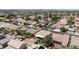 Aerial view showcasing neighborhood layout, homes with pools, and nearby amenities at 2025 Dakota Lodge Ave, Las Vegas, NV 89123