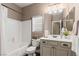 Bathroom features single sink vanity and shower and tub combo with white tile at 2025 Dakota Lodge Ave, Las Vegas, NV 89123