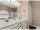 Bathroom featuring double sinks, vanity and a walk-in shower, providing luxury and functionality at 2025 Dakota Lodge Ave, Las Vegas, NV 89123