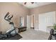 Exercise room with exercise bike, weights, bench and large closet at 2025 Dakota Lodge Ave, Las Vegas, NV 89123