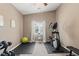 Exercise room featuring elliptical machine, weights, exercise ball and rubber mats at 2025 Dakota Lodge Ave, Las Vegas, NV 89123