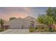 Charming single-story home with a three-car garage, well-maintained landscaping, and inviting curb appeal at 2025 Dakota Lodge Ave, Las Vegas, NV 89123