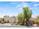 Attractive single-story home boasts a three-car garage and well-maintained desert landscaping at 2025 Dakota Lodge Ave, Las Vegas, NV 89123