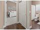 Hallway with bedroom on the left and powder room with toilet to the right at 2025 Dakota Lodge Ave, Las Vegas, NV 89123