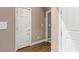 Hallway featuring hardwood flooring and neutral paint, connecting different areas of the house at 2025 Dakota Lodge Ave, Las Vegas, NV 89123