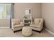 Cozy living room with comfortable seating, decorative mirror, and natural light creating a welcoming atmosphere at 2025 Dakota Lodge Ave, Las Vegas, NV 89123