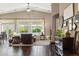 Bright living room with large windows, hardwood floors, and an open concept layout at 2025 Dakota Lodge Ave, Las Vegas, NV 89123