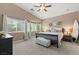 Serene main bedroom featuring a spacious layout, vaulted ceilings, and large windows with natural light at 2025 Dakota Lodge Ave, Las Vegas, NV 89123